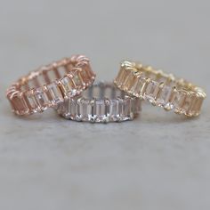 three different colored rings sitting next to each other