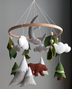 a mobile with various stuffed animals hanging from it's sides