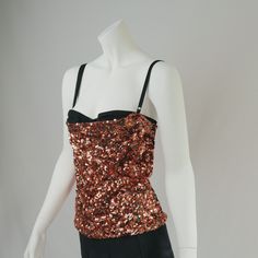 90s Vintage Dolce and Gabbana Bronze  sequin corset top featuring exposed bra detail, black adjustable straps, and center back zipper closure.  exquisite, would keep if this fit me  Size: 40 UK10  Pictured on size 6 UK pinned  Very Good Vintage Condition, minor wear to be expected of any secondhand item  Internal tags are loose and could do with a stitch to reinforce. The same item is currently on 1st dibs for 1500 USD Party Camisole Corset With Boned Bodice, Camisole Corset With Boned Bodice For Party, Party Corset With Spaghetti Straps And Built-in Bra, Sequined Fitted Corset For Party, Sequined Corset For Party Season, Sleeveless Sequin Evening Corset, Fitted Party Corset With Spaghetti Straps, Glamorous Sequined Corset For Night Out, Glamorous Evening Corset With Spaghetti Straps