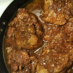 some food is being cooked in a skillet on the stove and ready to be eaten