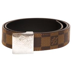 Louis Vuitton belt made with Damier Ebene coated canvas and features a silver-tone block buckle. COLOR: Brown MATERIAL: Coated canvas MEASURES: L 35.5” x W 1” SIZE: 80/32 EST. RETAIL: $675 COMES WITH: Dust bag CONDITION: Great - buckle shows scratches. Made in France ------------------------------------------------------------------------------------------------------------- CARTEBLANCHESHOP.COM is an online boutique which also provides curation, consignment and customization services for authentic designer luxury items. CARTEBLANCHESHOP.COM is not an authorized brand dealer of Hermes, Chanel, Gucci, Saint Laurent or Dior nor are we affiliated with these brands. We purchase many of our products outright through private auctions, individual collections, and directly from clients. We stand b Brown Checkered, Louis Vuitton Belt, Louis Vuitton Brown, Louis Vuitton Damier Ebene, Damier Ebene, Boutique Online, Louis Vuitton Bags, Mens Belts, Luxury Items