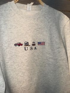 "USA" Embroidered sweatshirt.   Comes in a variety of colors and sizes-S,M,L,XL,2XL unisex sizing.  You can choose Different Thread Color. pick a Color from the chart and please leave a note in the personalisation section for different Color.  High quality Lane 7 crewnwck.  With any purchase you get FREE USPS delivery on us ! ---How To Order ---  Choose your size and color. Click add to cart. You can go back to add more product. Click "Proceed to check out". When you check out, you can add a not Streetwear Crew Sweatshirt With Custom Embroidery, Custom Embroidery Crew Neck Sweater For Streetwear, Casual Crew Sweatshirt With Embroidered Graphics, Casual Crew Neck Hoodie With Custom Embroidery, Casual Fleece Sweatshirt With Embroidered Graphics, Casual Hoodie With Embroidered Graphics And Crew Neck, Casual Crew Neck Hoodie With Embroidered Graphics, Embroided Crewneck, Usa Sweatshirt