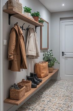 a coat rack with coats and shoes on it