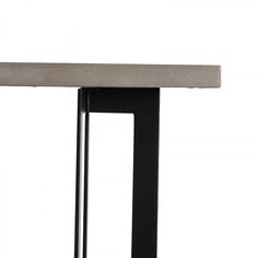 a table that has some kind of metal structure on it's base and is made out of concrete