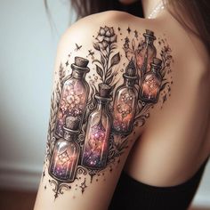 a woman's arm with three bottles filled with stars and flowers on the side