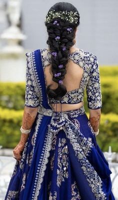 the back of a woman's dress in blue