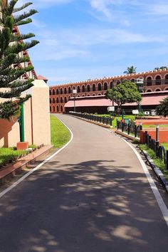 an empty street with a yellow sign that says cellular jail on it's side