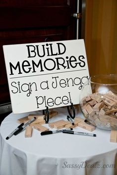 a sign that says build memories on top of a table with scissors and other items