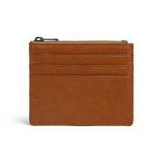 Introducing our RFID Wallet Card Holder, meticulously crafted from full grain Italian vegetable tanned leather. This premium material ensures durability and a luxurious feel, perfect for everyday use. Key Features: Material: Full grain Italian vegetable tanned leather, known for its quality and natural appearance. Size: Compact dimensions of 8.5 x 11 cm, ideal for easy carrying. Color: Cuoio, a rich and classic shade that ages beautifully over time.Structure:4 credit card slots for organized storage.1 top zipper pocket for secure storage of coins or other essentials.RFID blocking function to protect your credit cards and personal information from unauthorized scanning. Enhance your security and style with this RFID wallet card holder, designed for those who prioritize both functionality an Classic Leather Coin Purse With Card Slots, Classic Everyday Coin Purse With Smooth Grain, Leather Card Holder With Coin Pocket For Everyday Use, Modern Leather Coin Purse With Rfid Blocking, Modern Leather Rfid Blocking Coin Purse, Classic Leather Card Holder With Coin Pocket, Classic Leather Coin Purse With Rfid Blocking, Classic Leather Wallets With Card Slots, Cognac Leather Card Holder With Interior Slots