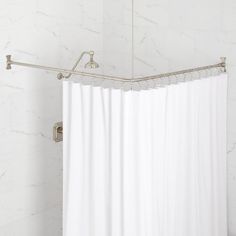 a white shower curtain in a bathroom