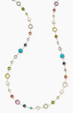 A multifaceted rainbow of bezel-set stones traces a shining 18-karat yellow-gold necklace. 36" length Lobster clasp closure 18k gold/clear quartz/amethyst/blue topaz/citrine/mother-of-pearl/London blue topaz/peridot/green amethyst/pink tourmaline/turquoise Imported Peridot Green, Rainbow Necklace, Rock Candy, Station Necklace, Green Amethyst, London Blue Topaz, London Blue, Pink Tourmaline, Clear Quartz