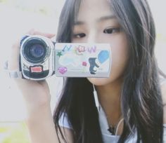 a woman taking a photo with her camera