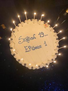 a birthday cake with candles on it that says season 19 episode 1 and the date is written in blue