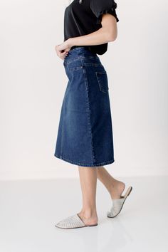 Simple lines, classic and comfortable, the 'Sara' is everything a denim skirt should be. Wide waistband for extra comfort and ease of styling. Exclusively designed by us for you. 95% Cotton/ 5% Spandex Machine Wash Cold, Tumble Dry Low Functional Back Pockets Available in both 21" ,24", and 26" length   Model Height: 5'8 | Wearing size 2 in 26" Length Dark Denim Skirt, Jean Skirt Outfits, Selling Clothes, Dark Wash Denim, Wide Waistband, Jean Skirt, Simple Lines, Dark Denim, Main Street