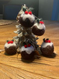 small christmas tree made out of coconuts on a wooden table