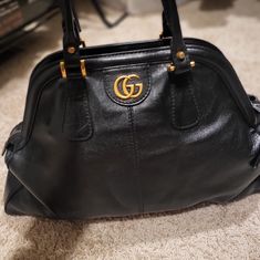 Excellent Condition. There Is A Small Scratches But Almost Brand New Beautiful Vintage Black Leather And Big Size Of Women Handbag. It Was Gucci Luxury Line Bag And It Is Good Bag For You If You Carry A Lots Of Stuff With You. No Refund. No Exchange. Gucci Satchel With Branded Hardware For Evening, Gucci Evening Satchel With Branded Hardware, Gucci Satchel With Branded Hardware For Office, Black Gucci Top Handle Satchel, Gucci Chic Satchel For Office, Designer Gucci Satchel For Evening, Chic Gucci Satchel For Office, Gucci Black Satchel Shoulder Bag, Black Gucci Satchel Shoulder Bag