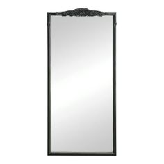 a large mirror with an ornate design on the front and back side, in black