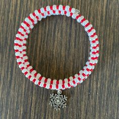 Handmade Christmas Wrap Bracelet Is Made To Look Like A Candy Cane, With Red And White Seed Beads, And A Silver Plated Snowflake Charm One Size Fits Most Red Seed Beads White, Pearlized Seed Beads Silver Plated Snowflake Charm Handcrafted By Me Gift Boxed, Ready To Wrap I Always Ship Same Day Or Next Business Day Custom Orders Are Always Welcome Any Questions Please Ask! Women’s Jewelry Women’s Bracelets Holidays Women’s Accessories Christmas Bracelets Holiday Bracelets Wrap Bracelets Festive Memory Bracelets Candy Canes Snowflakes Casual Contemporary Seasonal Winter Layered School College Office Festivals Concerts Parties Celebrations Gradu White Beaded Christmas Jewelry, Handmade White Holiday Jewelry, White Round Bead Bracelets For Holiday, White Adjustable Beaded Bracelets For Holidays, Adjustable White Beaded Bracelets For Holiday, Holiday White Beaded Jewelry, Handmade Red Beaded Bracelets For Holidays, Christmas White Bracelets With Colorful Beads, White Christmas Bracelets With Colorful Beads