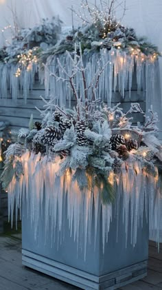 a planter filled with ice and pine cones