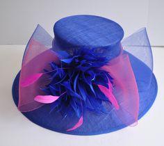 "Description: 100% Sinamay, light and comfortable *Wide brim measure Appr: 6.5\" brim *The crown is decorated with feather flowers, peacock feathers and crin ribbon bow *Head girth is 22\"-23.5\",adjustable string inside can give you the best fit. *Great for Kentucky Derby, Church, Wedding, Tea Party or other special event Many color decorations are AVA, just like: hot pink, light blue, royal blue, black, burgundy, yellow, white, dusty pink, taupe." Feather Flowers, Sinamay Hat, Royal Ascot Hats, Sinamay Hats, Ascot Hats, Tea Party Wedding, Wedding Tea, Elegant Hats, Feather Flower