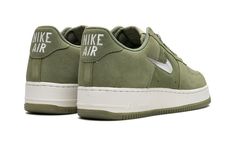 The Nike Air Force 1 Low "Color Of The Month - Oil Green" is a colorway of the retro basketball shoe from the “Color of the Month” collection that was originally started by Baltimore sneaker stores in 1984.  By ordering the Air Force 1 in an assortment of colorways from Nike, Baltimore sneaker shops helped save the shoe from being discontinued.  The “Color of the Month” collection in the present day honors and revives the look of the Air Force 1s from the throwback line.  The “Oil Green” feature Color Of The Month, Air Force 1s, Retro Basketball Shoes, Retro Basketball, Sneaker Stores, Nike Air Force 1 Low, Air Force Ones, Air Force 1 Low, Green Suede