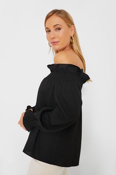 Our favorite lady, Marguerite, is back and better than ever. Add a bit of off the shoulder sass to your look with a structured elasticated ruffle neckline and cuffs. We are styling this top with fun statement earrings and heels for date night and dinner with friends all year long. Off-the-shoulder neckline Elasticated shoulder with ruffle trim Long sleeves Elasticated cuffs Relaxed fit Material: 100% polyester Care: Machine wash cold Off-shoulder Top With Smocked Bodice For Fall, Chic Smocked Top With Elastic Neckline For Brunch, Chic Blouse With Smocked Back And Ruffle Sleeves, Elegant Off-shoulder Top With Ruffles, Fall Off-shoulder Blouse With Blouson Sleeves, Off-shoulder Blouse With Blouson Sleeves For Fall, Fall Blouse With Blouson Sleeves And Off-shoulder Design, Off-shoulder Ruffled Tops For Brunch, Off-shoulder Top With Ruffles For Brunch