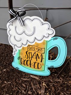 a wooden sign with a beer mug on it