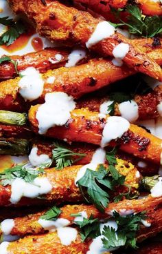 grilled carrots with ranch dressing and parsley on top, ready to be eaten