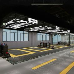 an empty parking garage with yellow lines painted on the floor