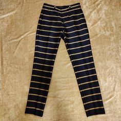 New With Tag In Perfect Condition A Great Pair Of Pants For A Sharp Look That Is Dynamic And Energetic, And Of Course Chic Modern And Metro Style, A Luxury Sheen Fabric In Dark Navy Blue Background With Horizontal Gold Tan Stripes. Slim Fit Design Two Side Pockets And Two Back Pockets, Five Belt Loops Size 0 With The Following Flat Measurements: Waist 14.5" (29" Cir.) Front Rise Near 9" Inseam 30" Leg Opening 6.25" Questions? Leave A Comment Below Fitted Linen Pants, Camel Pants, 25 Questions, Metro Style, Stripe Pants, Grey Dress Pants, Navy Blue Background, Printed Trousers, Brown Pants