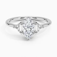 an oval and baguette cut diamond engagement ring