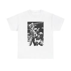 a white t - shirt with a black and white photo of a basketball player on it