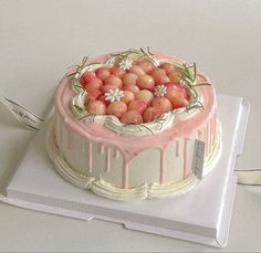 a cake with icing and flowers on it