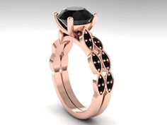 a rose gold engagement ring with black diamonds