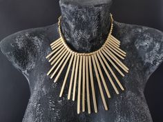 Ethnic Gold Plated Statement Necklace | Tribal Large Pendant Necklace | Bohemian Jewelry | Boho Chic Torque | Boho Jewelry | Gold Plated Jewelry Inspired by ancient tribal pieces mixed with a touch of modern design. Solid with a beautiful design this antique matte gold plated zamak necklace is a stunning piece, perfect to make everyone's attention turned on you. . Handmade Necklace * Gold Plated * Lead & Nickel free * Hypoallergenic * Has an adjustable chain, so you can arrange the length of Bohemian Bronze Necklaces For Party, Bronze Bohemian Necklace For Party, Bohemian Bronze Necklace For Parties, Boho Jewelry Gold, Silver Boho Jewelry, Silver Mask, Boho Chic Earrings, Big Necklace, Large Pendant Necklace