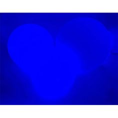 a blue heart shaped object in the dark