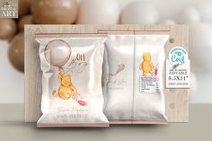 two bags of chocolate with winnie the pooh on them and balloons in the background