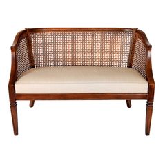 a wooden bench with beige upholstered cushions