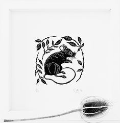 a black and white drawing of a rat in a circle with leaves on it's back