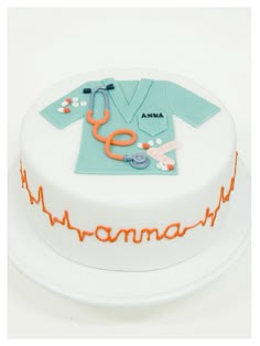 a cake that is decorated with an image of a doctor's shirt and stethoscope