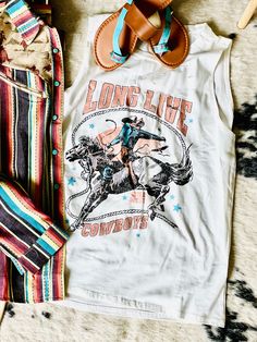 Cowboys will always be our favorite! Distressed tank top, that fits like your favorite tee. True to size! Graphic Print Cotton Tank Top, Cotton Graphic Print Tank Top, Cotton Racerback Muscle Tee With Graphic Print, Fun Summer Sleeveless T-shirt, Fun Sleeveless Summer T-shirt, Fun Cotton Tank Top With Letter Print, Spring Graphic Muscle Tank Tee, Spring Graphic Tank Top, White Muscle Tee With Graphic Print