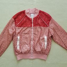 New With Tags. Brand: Silvian Heach. Composition: 100% Polyester. A Two-Tone Sequin Bomber Jacket Size Xxs. Dropped Shoulder. Ribbing At Collar, Cuffs, And Hem. Fully Lined. Approximate Measurements Laid Flat: Length 20". Armpit To Armpit 20.5". Shoulder To Shoulder 19". Sleeve Length ( From The Top Of Shoulder Seam To The Cuff Hem) 20". Price Is Firm. Ship Same Or Next Business Day. Smoke/Pet Free. Pink Stretch Winter Outerwear, Casual Stretch Outerwear For Parties, Spring Party Outerwear With Patchwork, Casual Pink Outerwear For Party, Stretch Patchwork Outerwear For Fall, Fall Stretch Patchwork Outerwear, Red Stretch Outerwear For Spring, Pink Long Sleeve Outerwear For Party, Pink Patchwork Outerwear For Fall