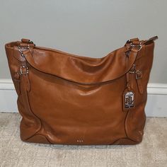 Polo By Ralph Lauren Bag 100% Cow Leather Good Condition No Spots In Lining Bottom Of The Bag Slightly Scuffed Light Brown Silver Hardware 15.5" Long 13" Deep 6-7" Wide Handle 17" From End To End Ralph Lauren Bag, Ralph Lauren Bags, Lauren Brown, Brown Silver, Large Tote Bag, Large Tote, Polo By Ralph Lauren, Silver Hardware, Cow Leather