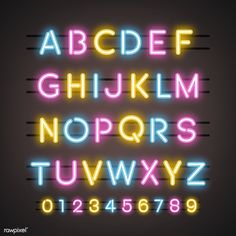 an illuminated neon alphabet with numbers and symbols