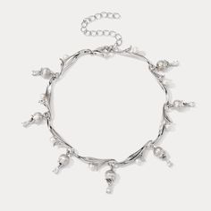 Elevate your style with the 925 Sterling Silver Lily of the Valley Bracelet, a silver diamond bracelet that epitomizes timeless grace. Exquisitely encased in premium 925 sterling silver, this elegant piece features delicate lily of the valley motifs accented by sparkling cubic zirconia stones that mimic the radiance of diamonds. Its refined design seamlessly transitions from day to night, adding a touch of sophistication to any ensemble while embodying the eternal beauty of nature's precious blo Elegant Sterling Silver Chain Bracelet For Party, Silver Fine Jewelry Chain Bracelet With Diamond Accents, Elegant Silver Chain Charm Bracelet For Formal Occasions, Luxury Silver Pearl Bracelet With Oyster Detail, Elegant Silver Diamond Bracelet With Silver Chain, Silver Chain Bracelet For Party Fine Jewelry, Luxury Silver Chain Bracelet For Party, Silver Chain Bracelet For Party In Fine Jewelry Style, Elegant Silver Charm Bracelet With Jubilee Style