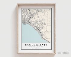 a framed map of san clemente, california in blue and white on a wall