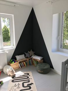 a child's room with black and white walls