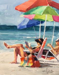 two people sitting under an umbrella at the beach reading books on a chair by the ocean