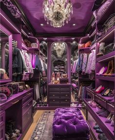 a purple closet with lots of shoes and bags on the floor, chandelier hanging from the ceiling