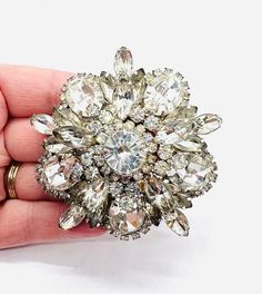 Absolutely Gorgeous Huge Vintage JULIANA Delizza & Elster Sparkling Clear Rhinestone Brooch. Rhodium plated metal securely prong set with clear rhinestones in various shapes and sizes. In excellent vintage condition with minimal age appropriate wear. Measures 3 inches across. Rollover clasp secure. Rollover clasp secure. Beautiful!! Silver Jeweled Brooches For Formal Occasions, Formal Silver Jeweled Brooches, Silver Crystal Brooch With Sparkling Stones, Silver Crystal Brooches With Sparkling Stones, Crystal Brooch For Wedding Jewelry, Crystal Brooch For Wedding, Wedding Crystal Brooches With Sparkling Stones, Silver Jeweled Brooch For Wedding, Silver Jeweled Wedding Brooch